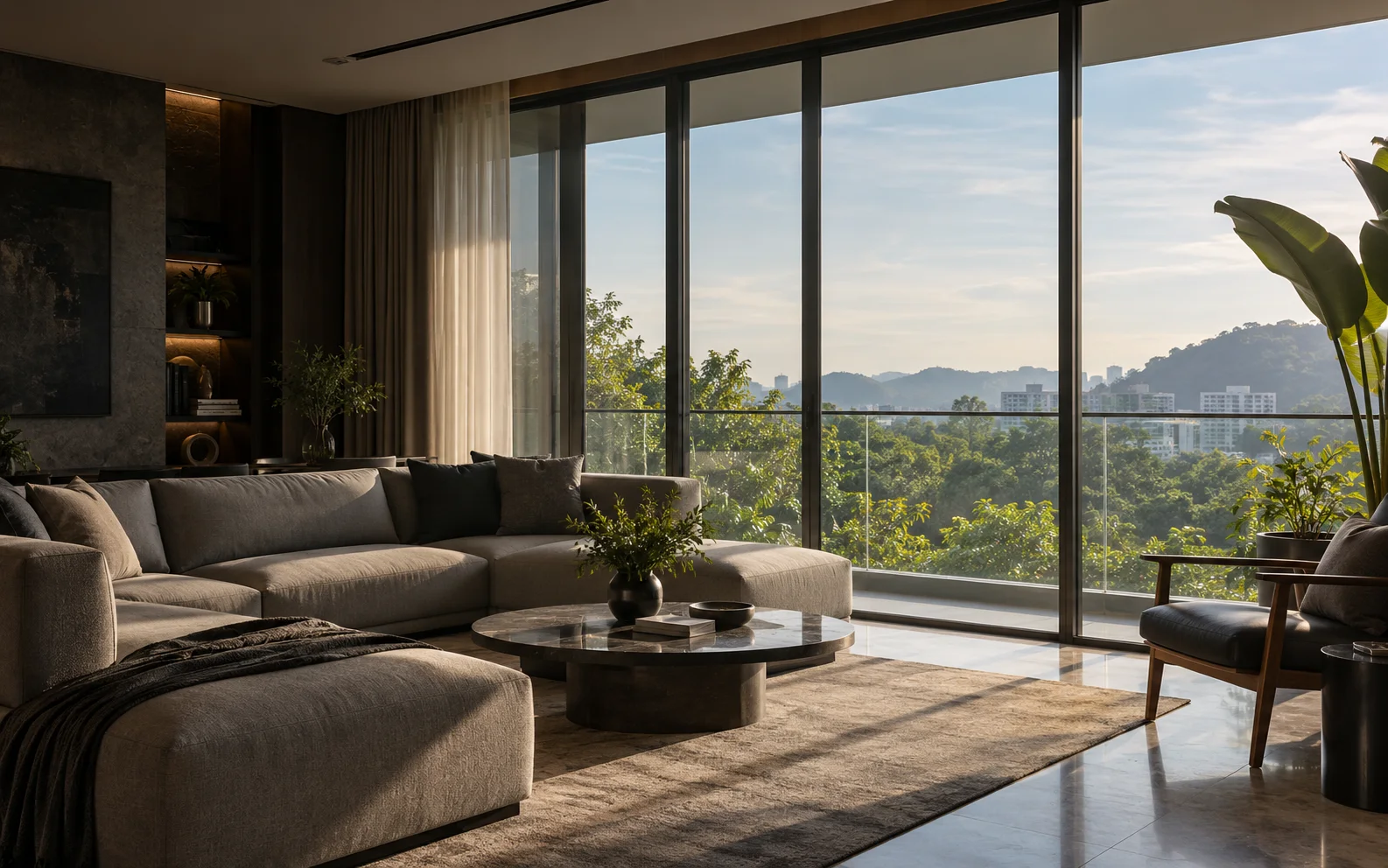 Living room with floor-to-ceiling windows looking out over trees and hills in soft evening light.
