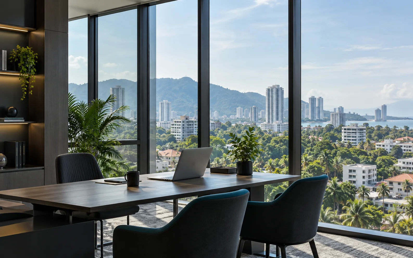 Office table beside floor-to-ceiling windows with a city and sea view.